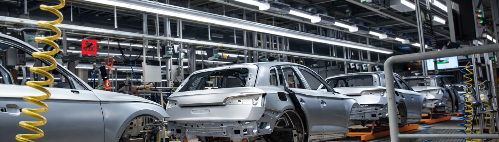 Industrial Asset Digitization dashboard on a tablet showing real-time IIoT performance metrics at The Denken Labs
